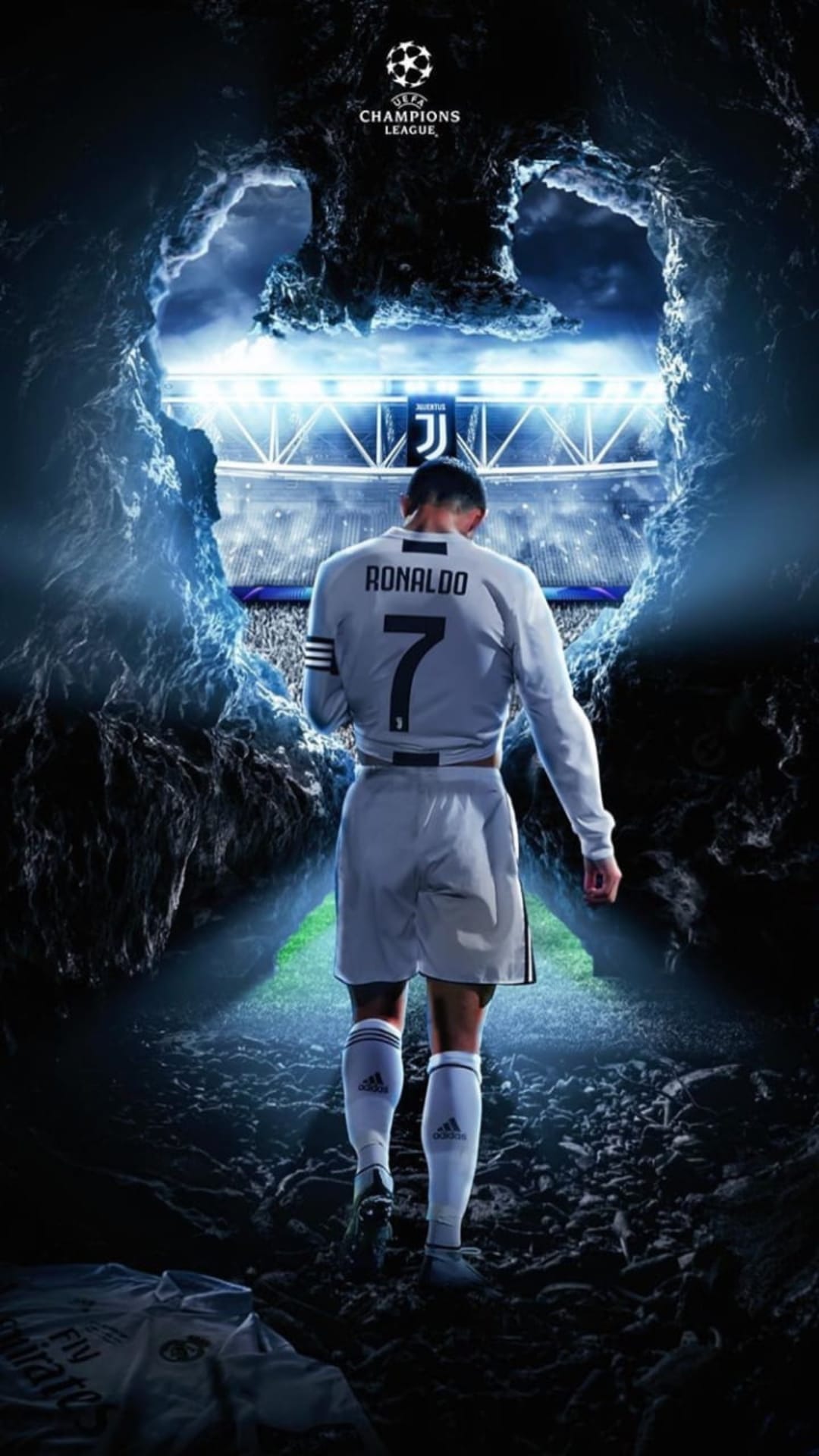 Cristiano Ronaldo in a Juventus jersey walks from a dark stone tunnel toward brilliant stadium floodlights.