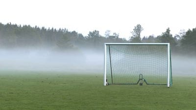 football goal,field,football,fog,trees,haze