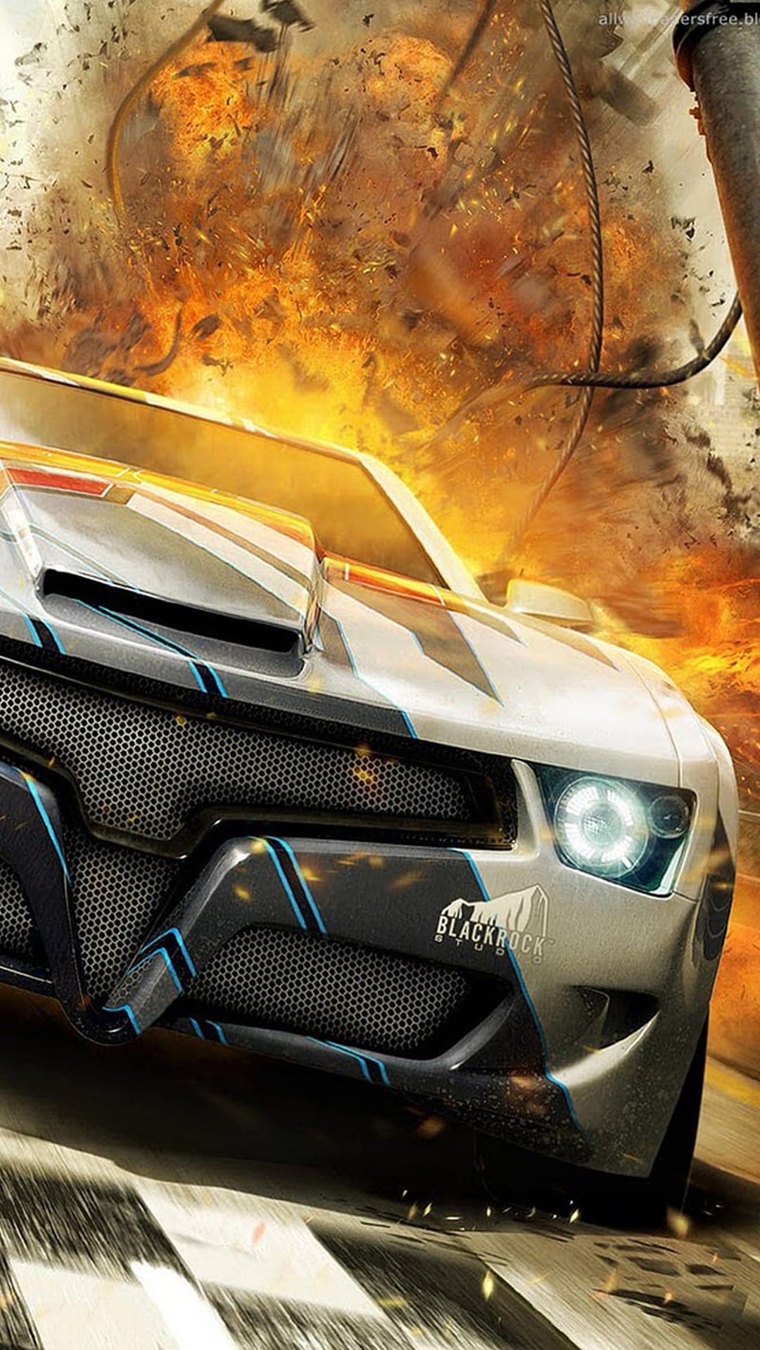 Futuristic sports car speeds from a massive orange fire explosion with shards of debris flying through the air.