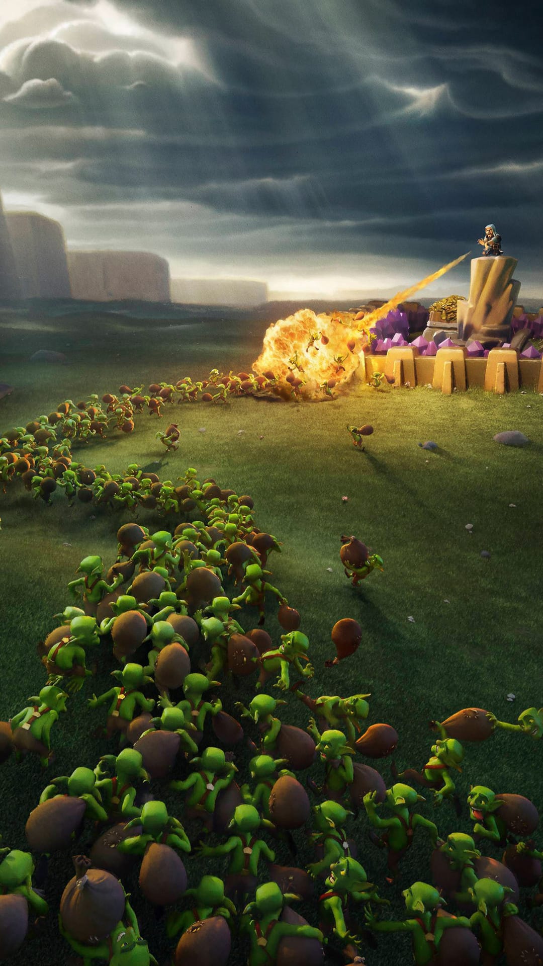 Green goblin horde escaping a wizard's fireball explosion near a gold and crystal wall in a grassy field.