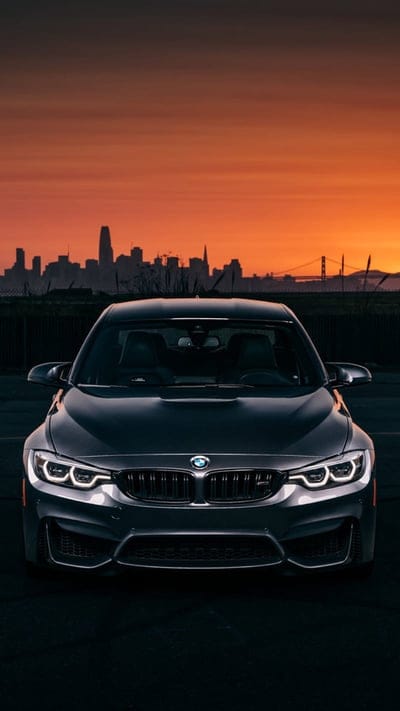 Car sunset, bmw, m5, supercar sports, city, skyline, mobile wallpaper, android wallpaper, iPhone wallpaper, phone wallpaper