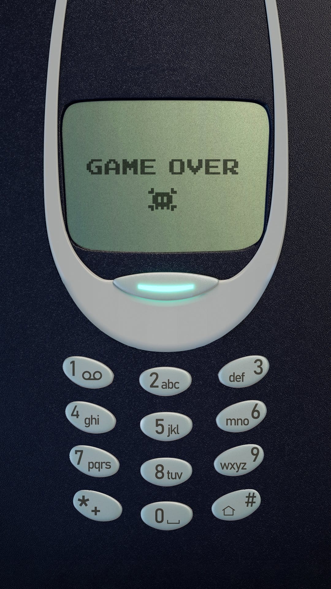 Classic Nokia phone screen displays pixelated game over text and a retro alien graphic on a green LCD display.