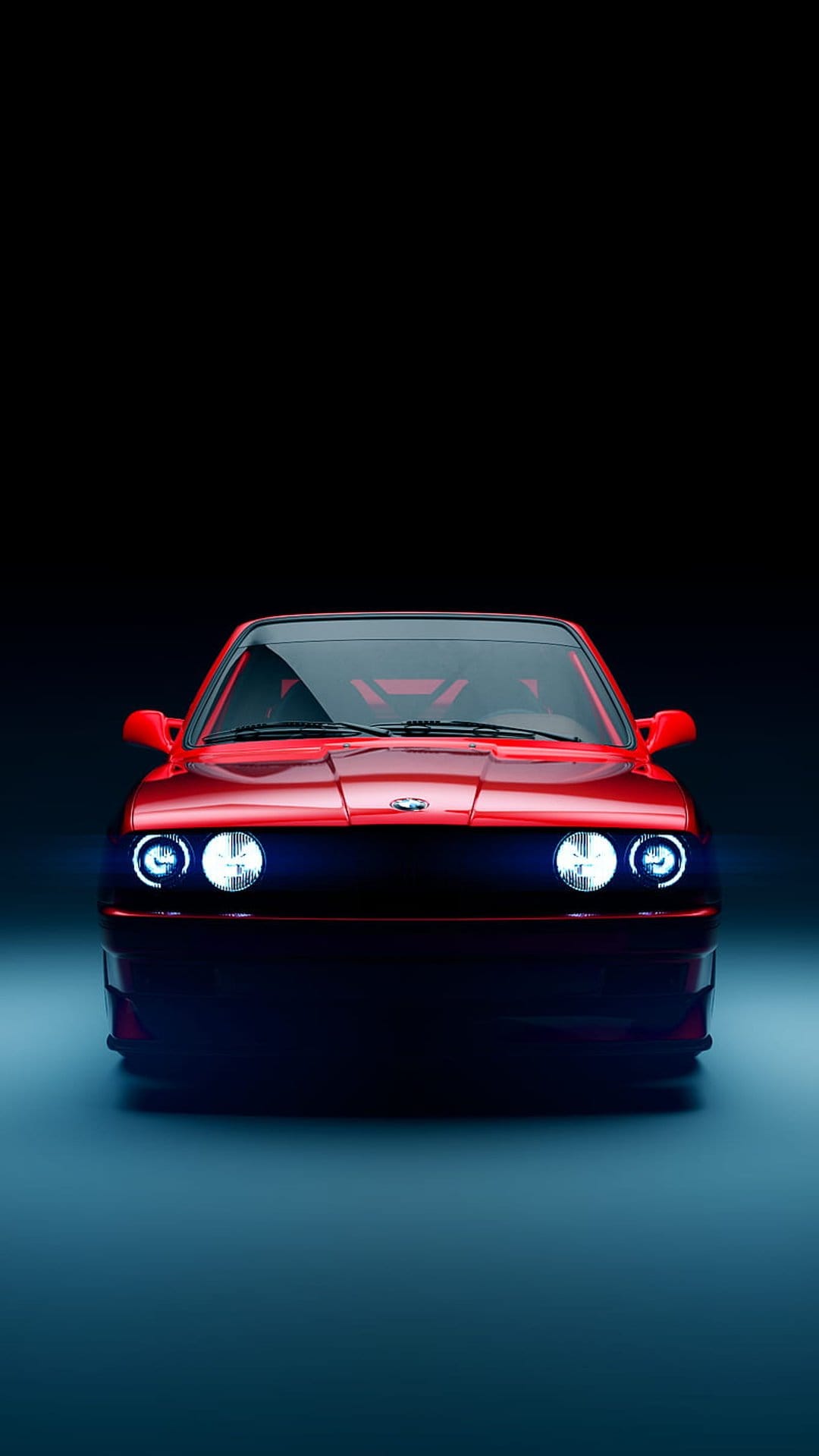 Red BMW E30 M3 front view with illuminated headlights and blue reflections in a dark, moody environment.