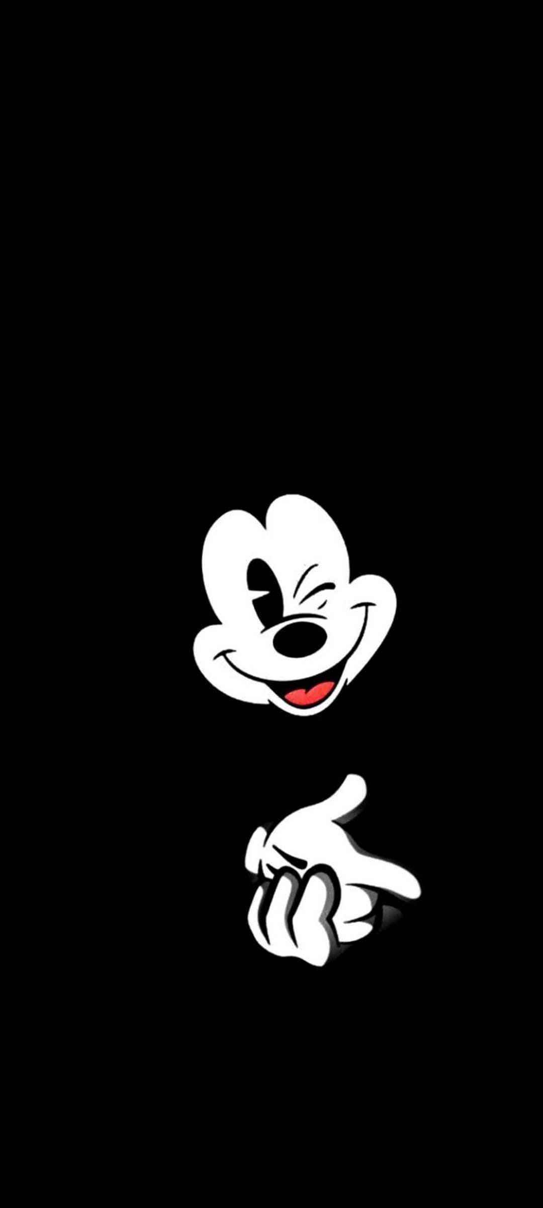 Mickey Mouse winks and gestures with his hand in a white outline style against a solid black background.