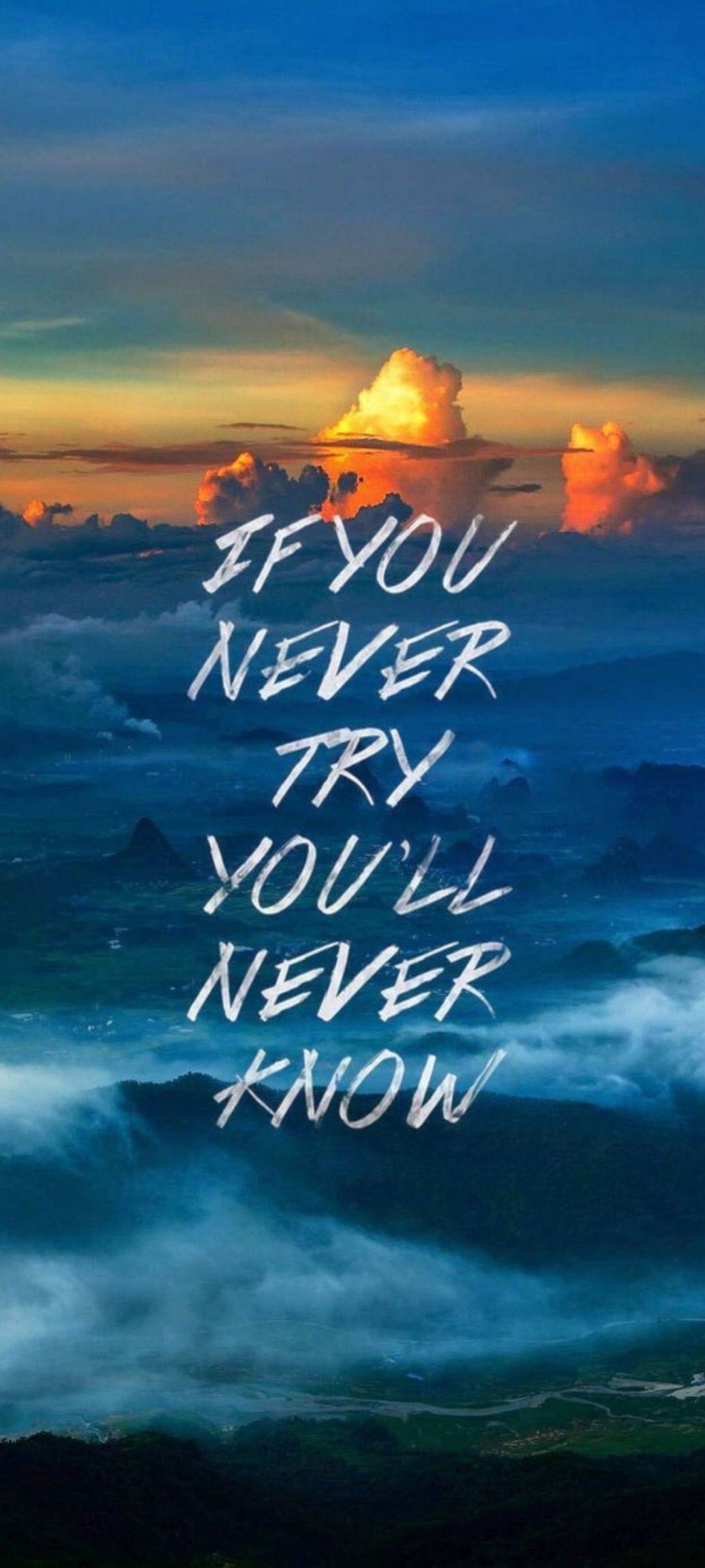 Motivational text over a sunset mountain landscape with orange clouds and dark silhouettes of jagged peaks.