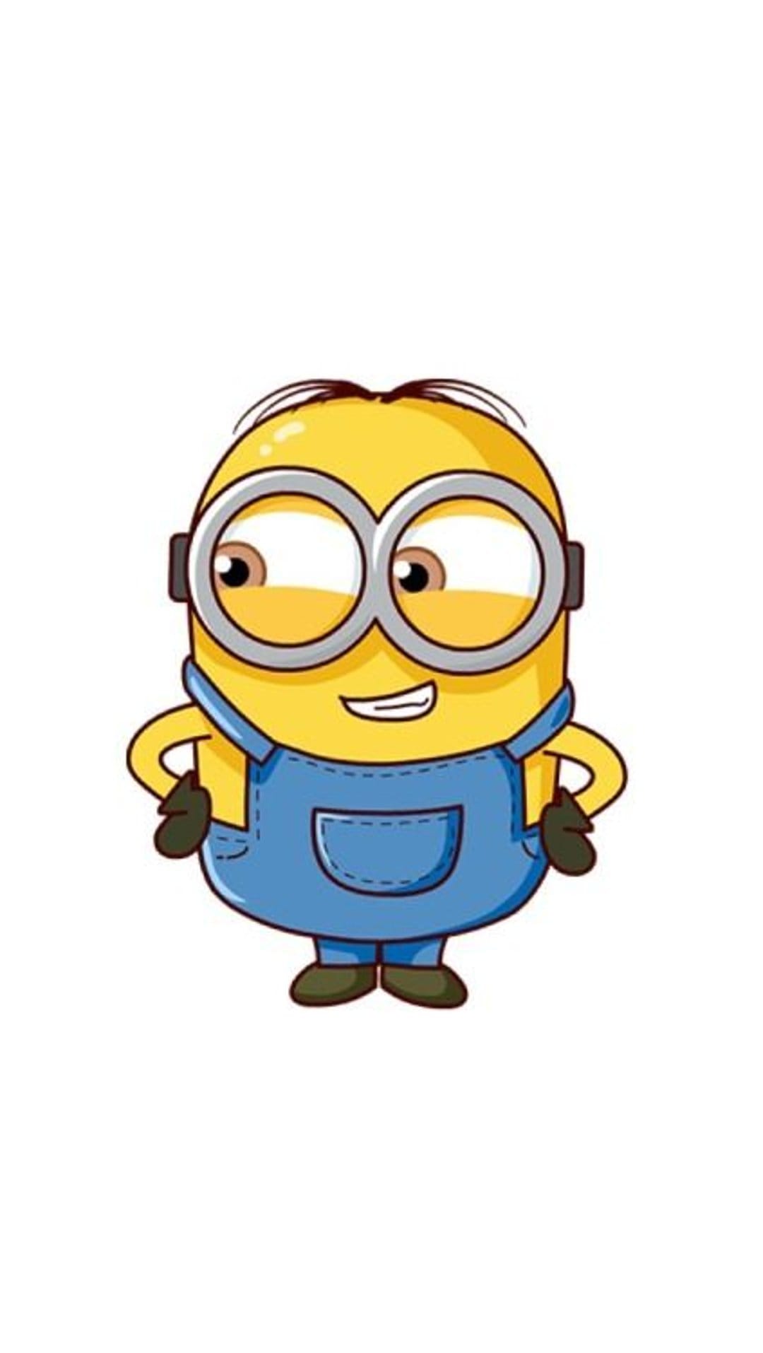 Single-eyed Minion wearing denim overalls and silver goggles stands smiling against a solid white background.