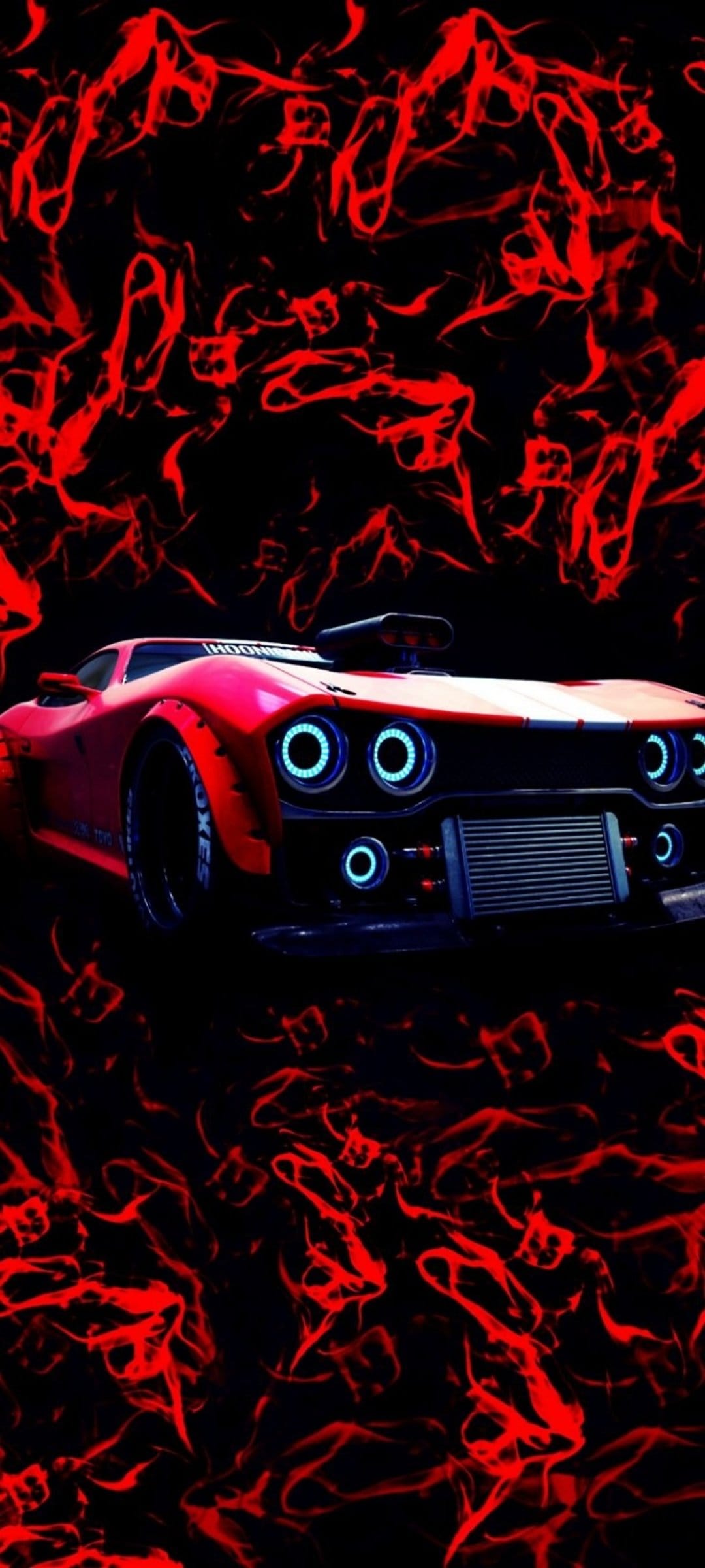 Red hot rod car with glowing blue headlights sits amidst swirling red flames and dark abstract smoke.