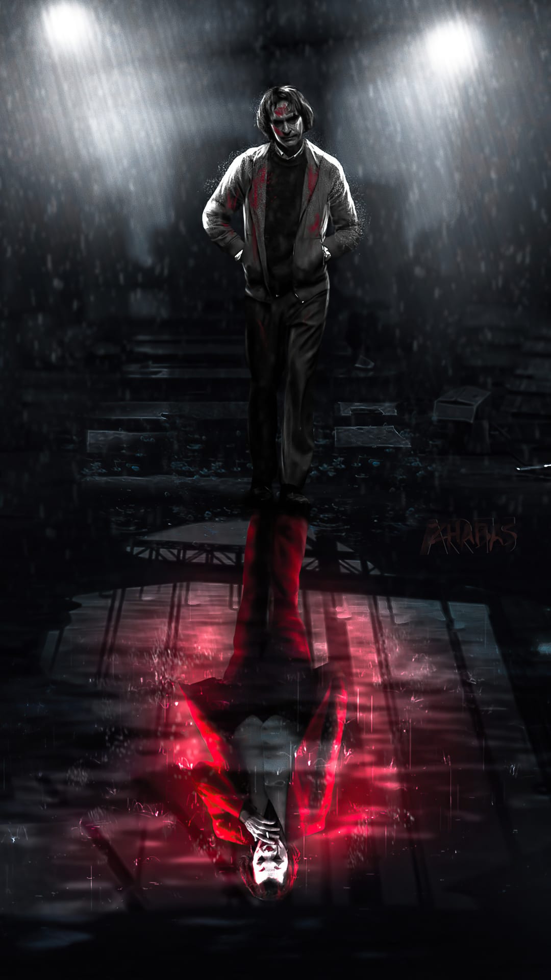 Joker stands in a wet Gotham alleyway with his distorted red reflection visible on the rain-soaked pavement.