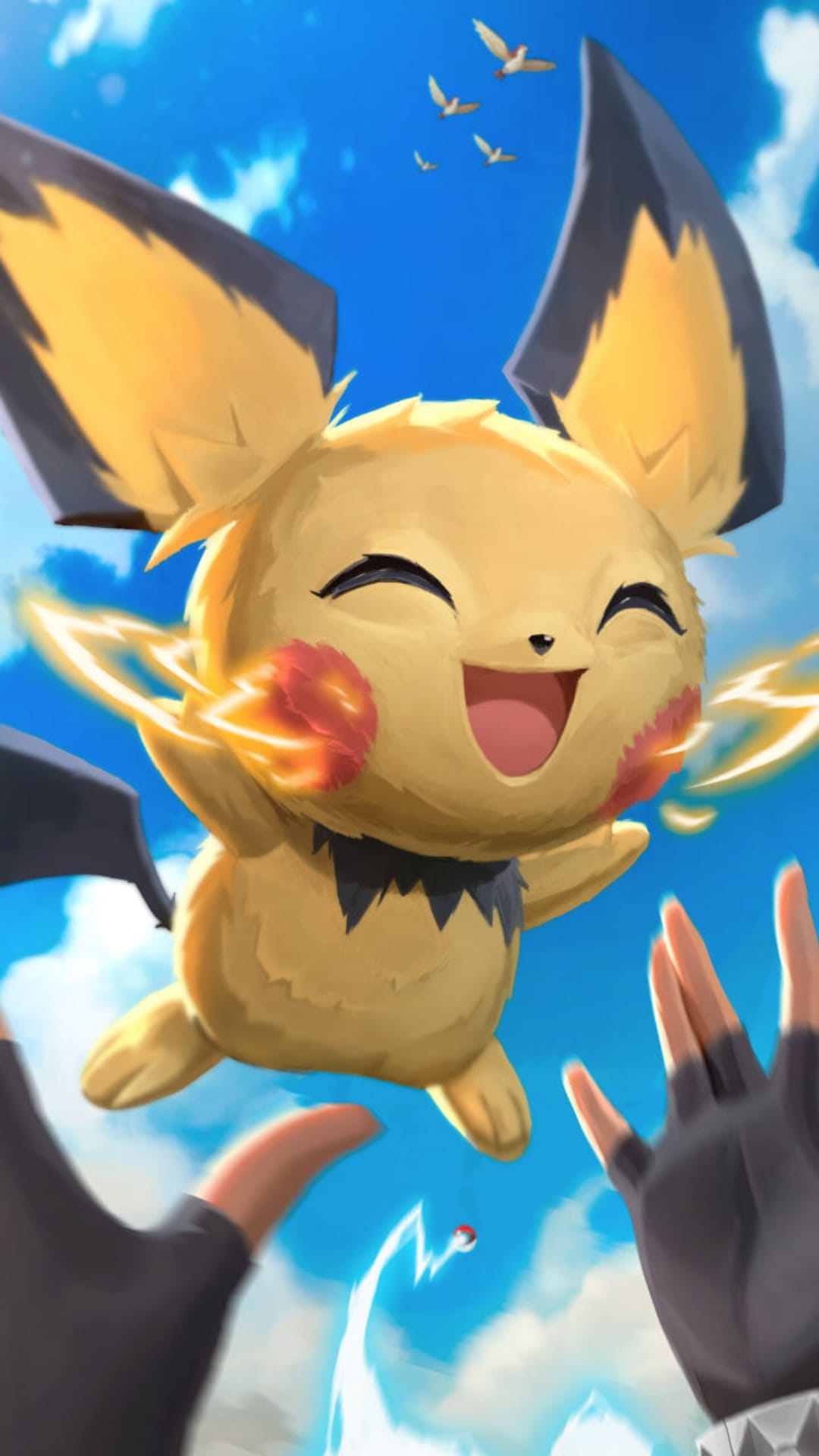 Pichu floats in a blue sky with sparks on its cheeks as gloved hands reach up toward the yellow Pokémon.
