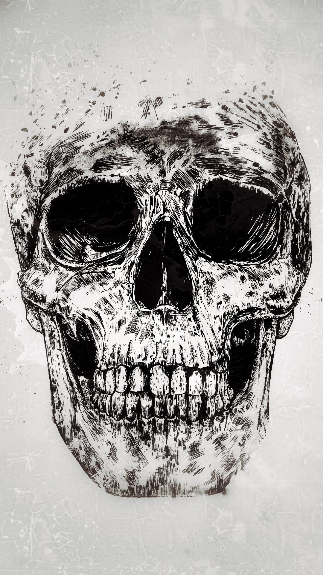 Human skull with dark ink splatters, deep black eye sockets, and weathered bone textures against a white backdrop.