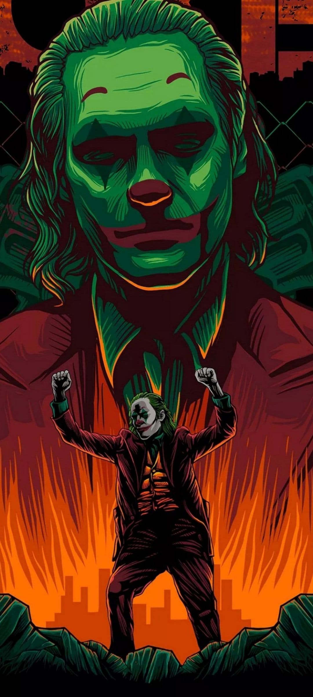 The Joker raises his fists in victory before a giant green face and orange flames against a dark city skyline.