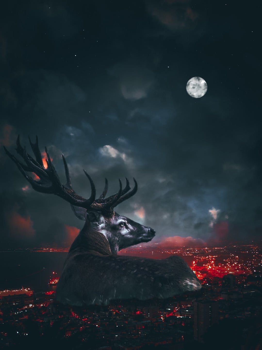 Majestic stag with large antlers silhouetted against a full moon over a glowing red and orange cityscape.