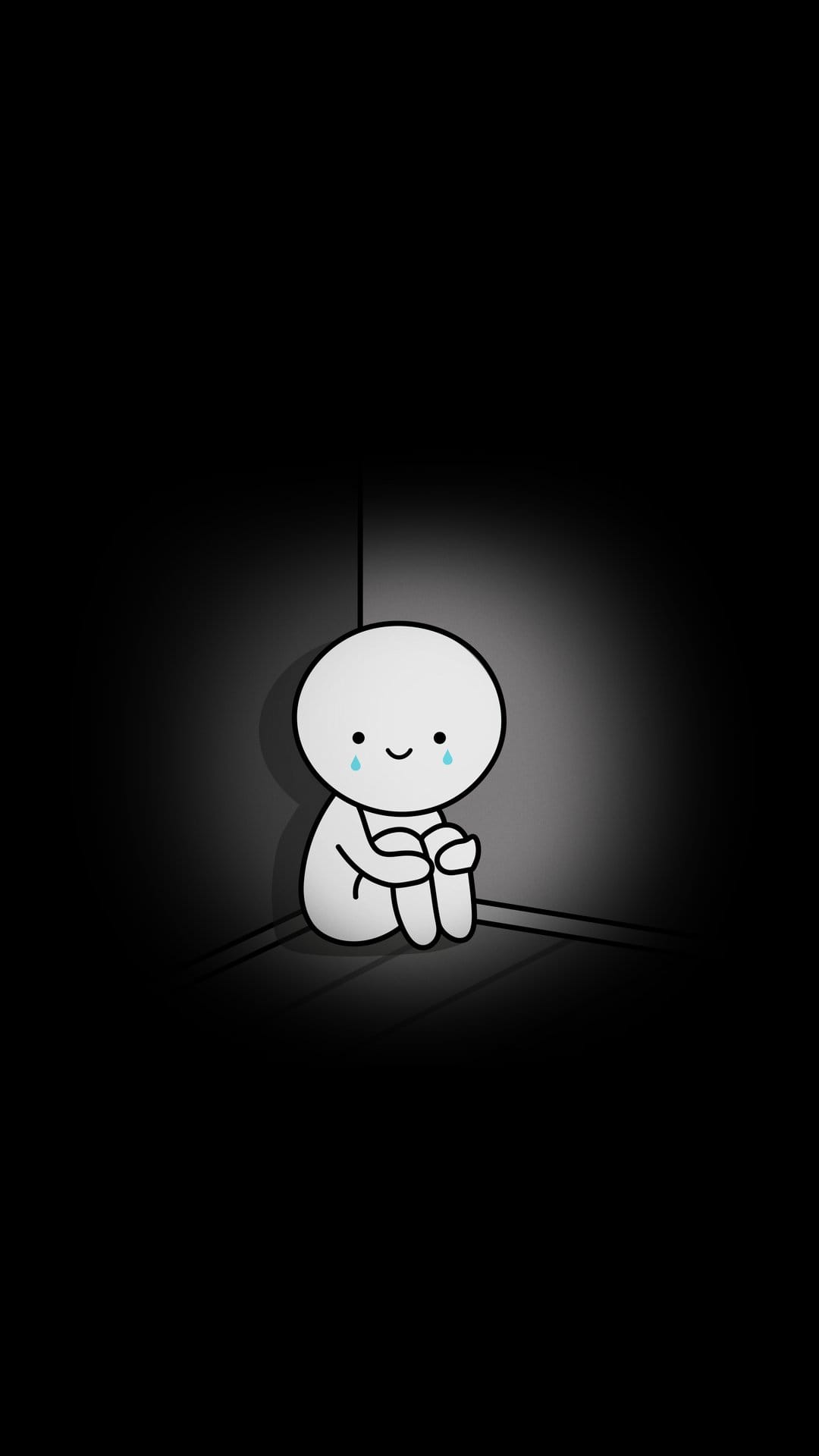 White round-headed figure curls up in a dark corner with blue tears falling under a bright overhead spotlight.