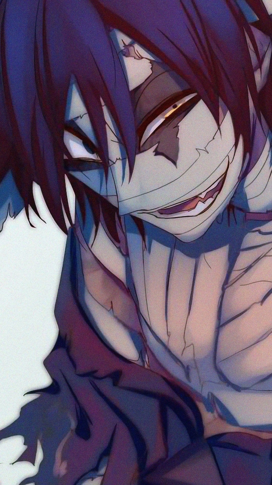 Isaac Foster with a bandaged face and a manic grin stares forward with intense eyes and dark messy hair.