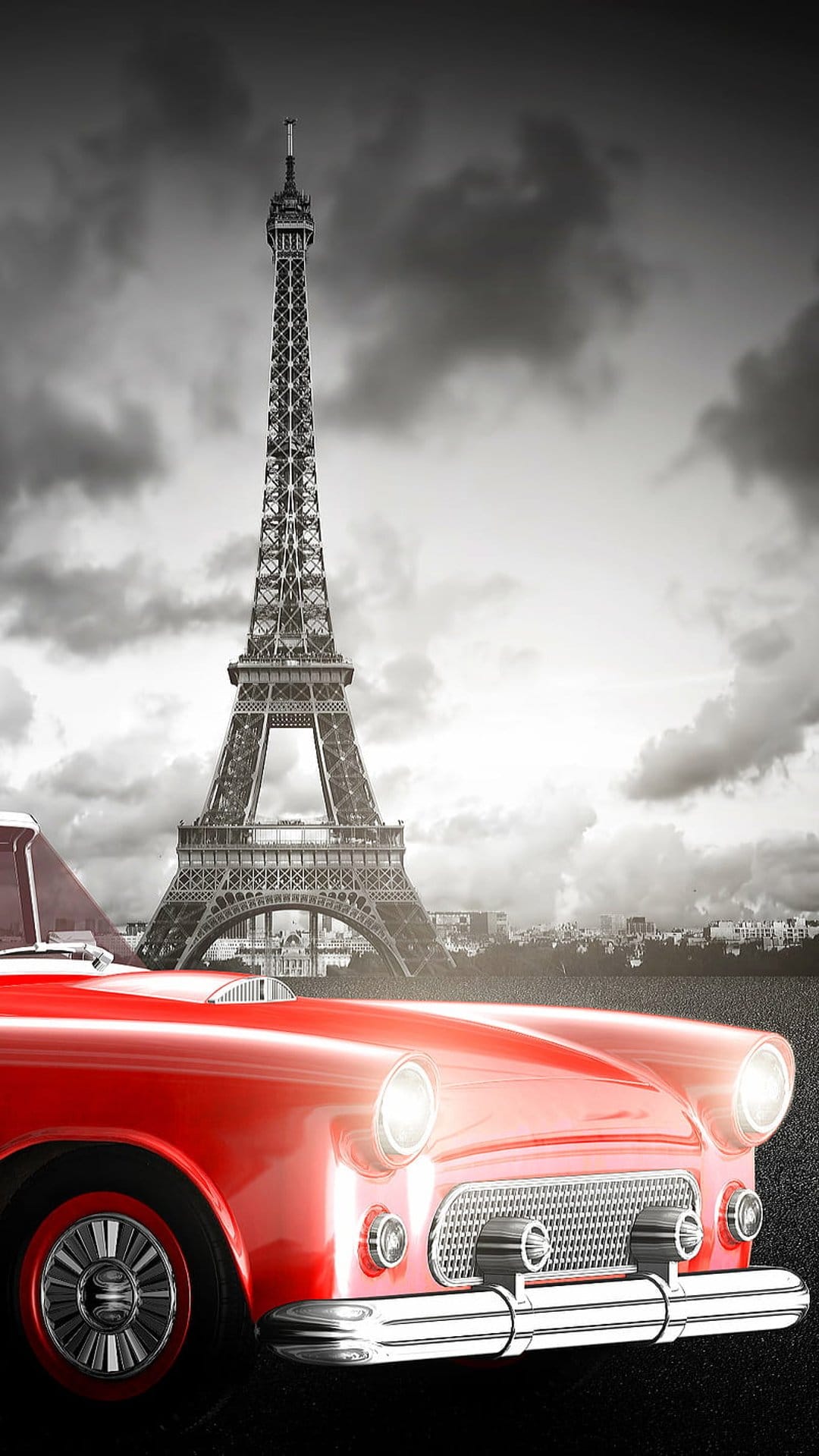 Red vintage car parked on a Parisian street with the Eiffel Tower standing tall under a cloudy sky.