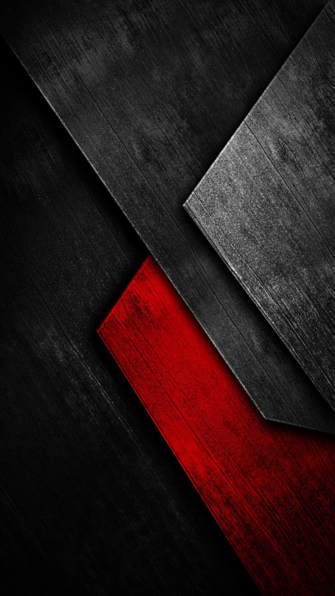 Overlapping charcoal wood planks with a vibrant red diagonal beam and gritty, weathered surface textures.
