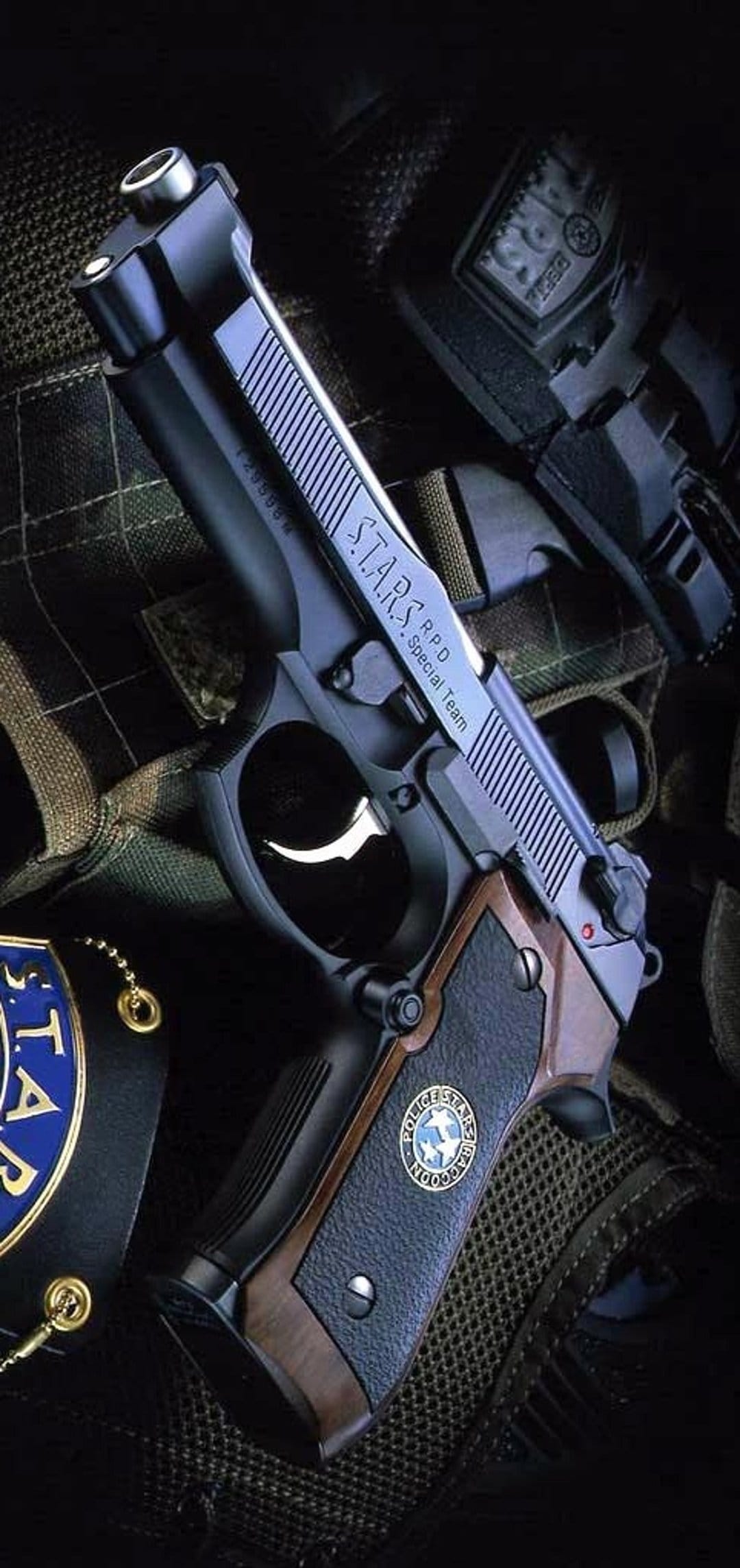 S.T.A.R.S. handgun and badge lie on a dark surface with visible engravings and a Raccoon City police crest.