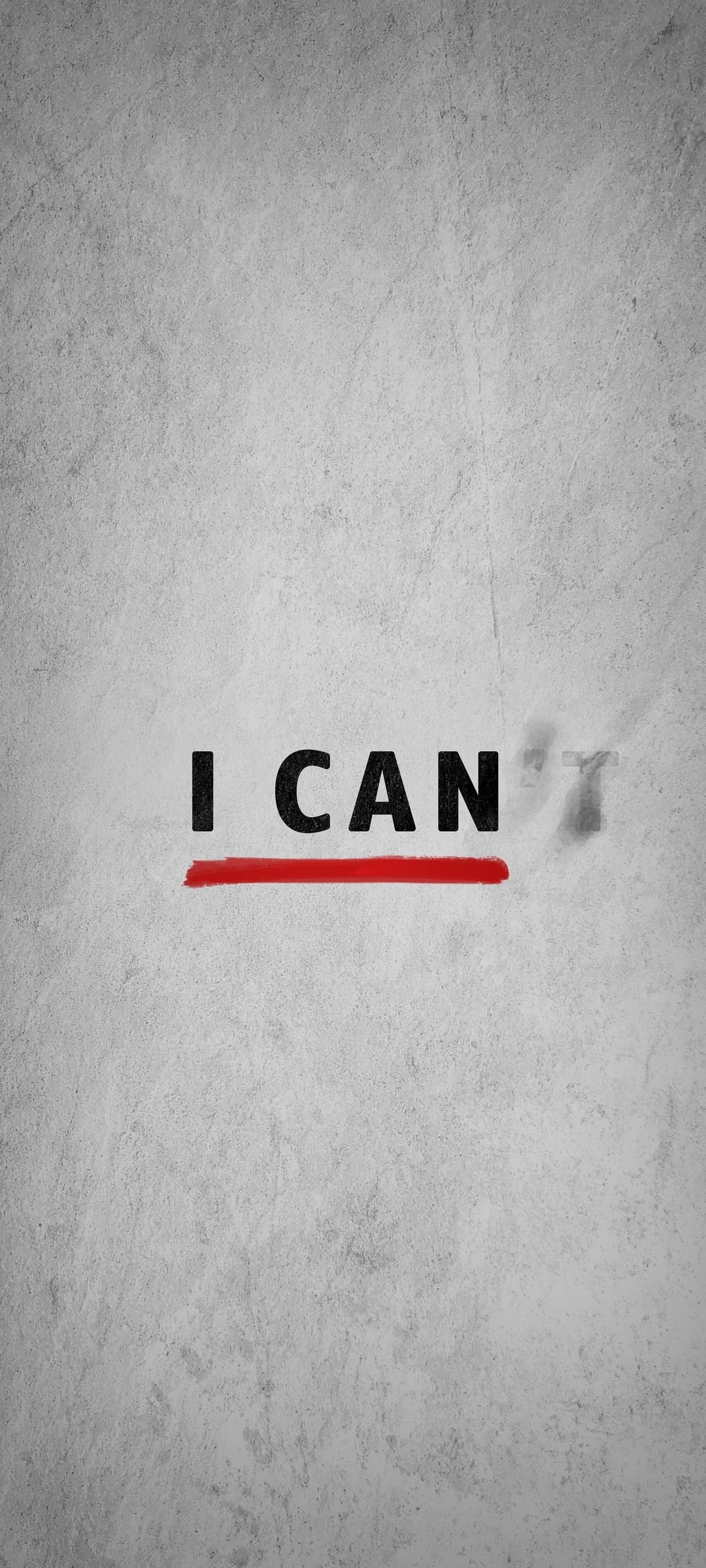 Bold black text reading I CAN on a textured grey concrete surface with a red line through the letter T.