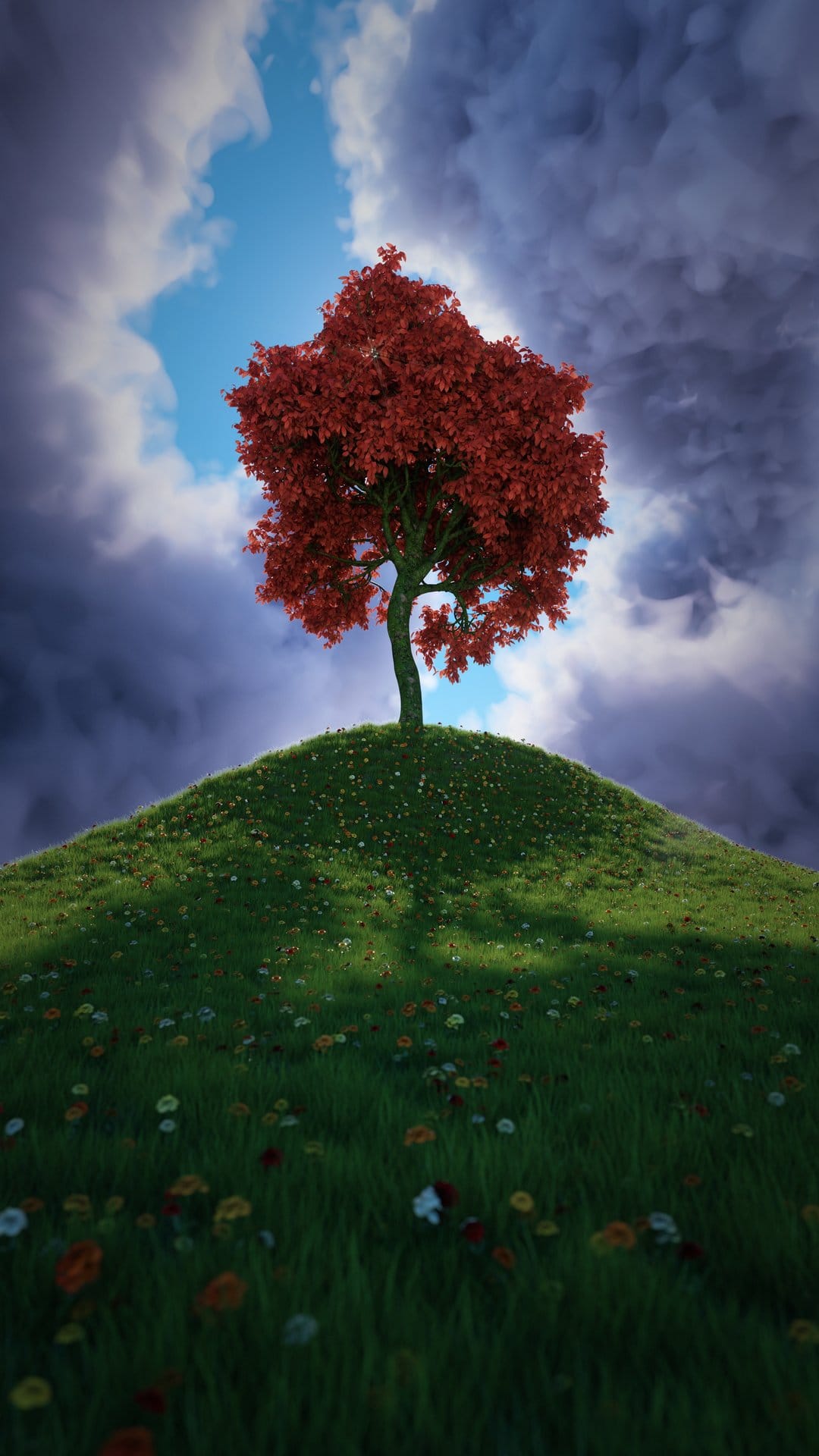 Red tree on a grassy hill with wildflowers under a blue and grey stormy sky in a portrait orientation frame.