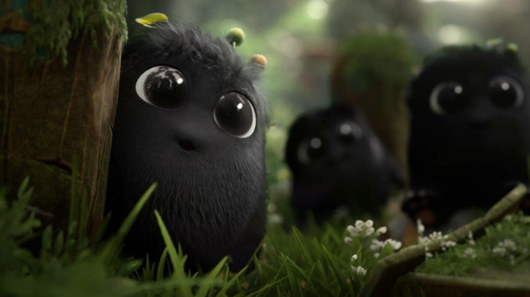Three black furry creatures with large eyes peeking from behind a mossy log in a sunlit green forest.