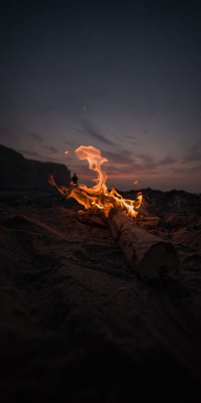 bonfire, beach, night, fire, sand, outdoor, dark, warm, glow, dramatic, sunset, twilight, peaceful, serene, tranquil, orange, red, sky, nature, wilderness, captivating, evening, aetherial, camping