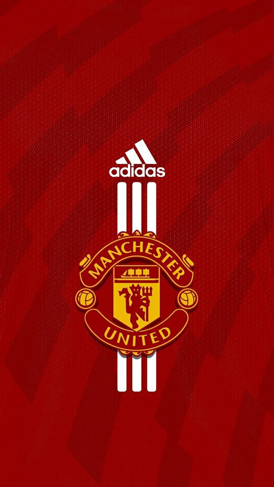 Manchester United club emblem and white vertical stripes centered on a textured red football jersey background.