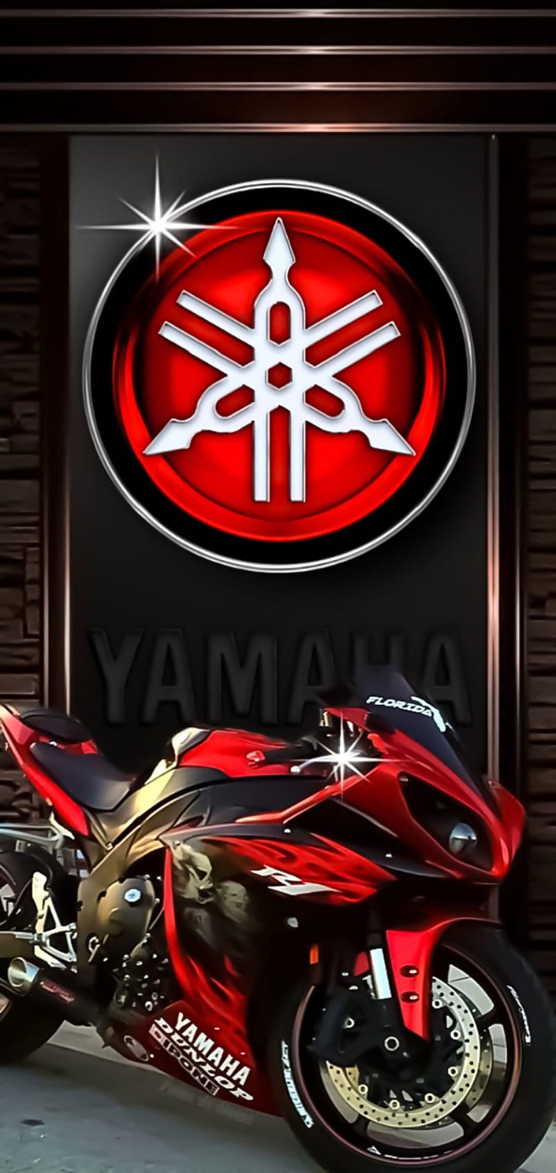 Yamaha R1 motorcycle with red flame graphics and a Florida windshield decal set against a dark, moody background.