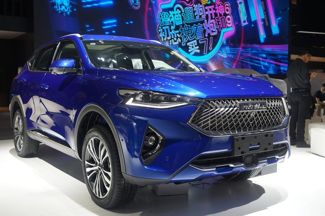 Blue Haval SUV with a honeycomb grille and LED headlights displayed against a glowing neon background.
