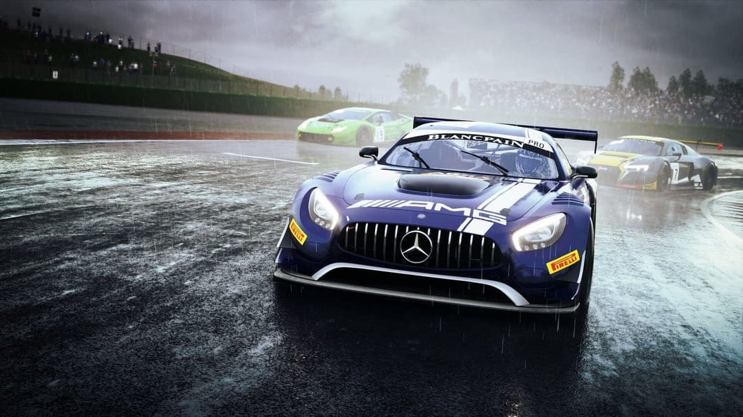 Blue Mercedes-AMG GT3 racing on a wet track in the rain with a Lamborghini and Audi trailing behind.