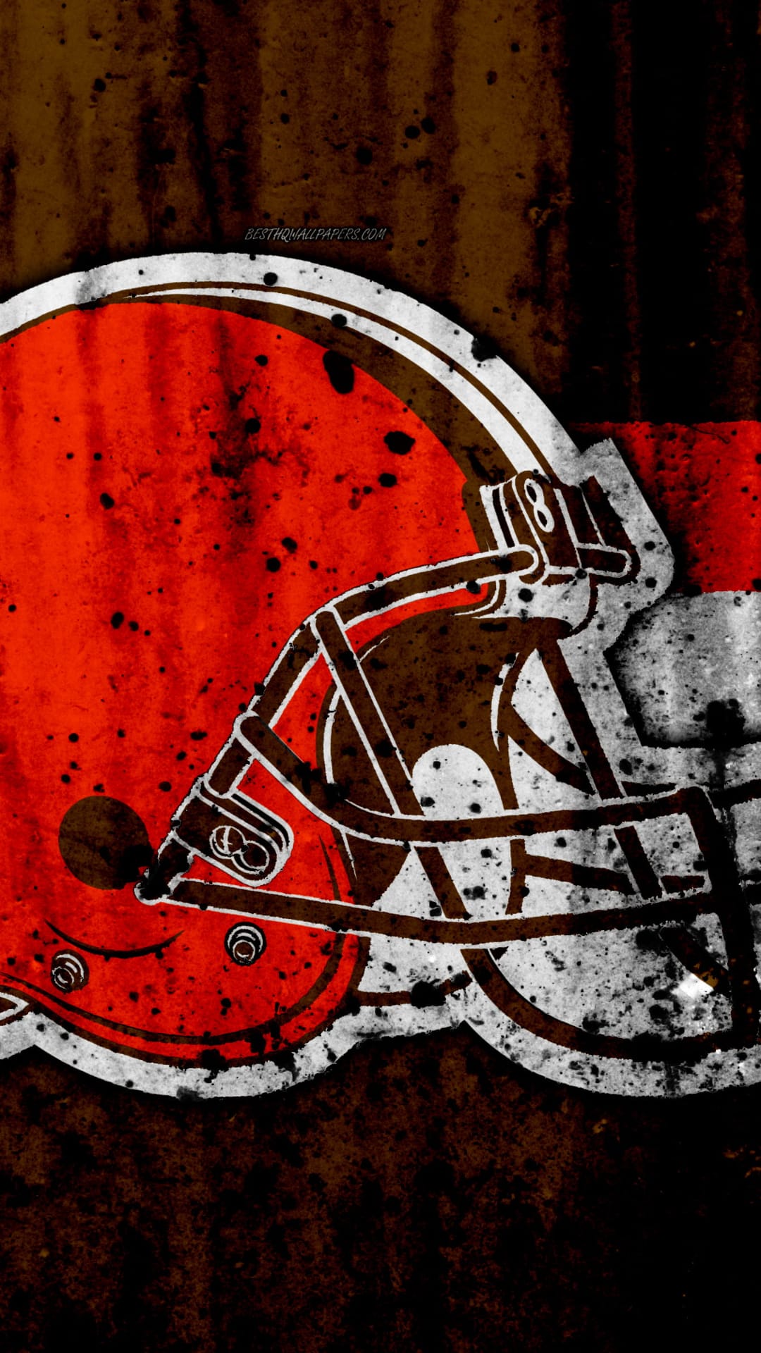 Cleveland Browns football helmet with distressed orange paint and white stripes against a dark grunge background.