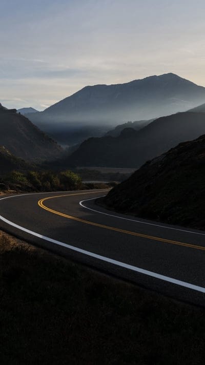 road, mountains, winding, scenic drive, misty, landscape, travel, journey, nature, peaceful, outdoor, beautiful, morning, evening, highway, journey, tranquil, serene, light, adventurous