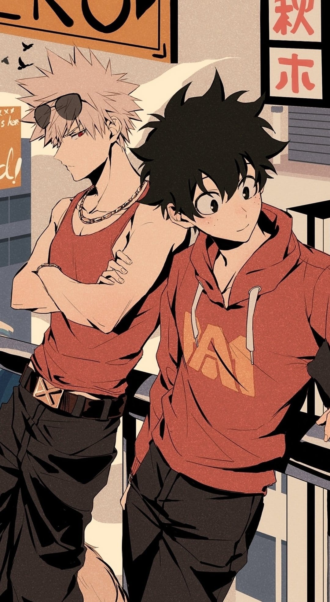 Spiky-haired blonde wearing sunglasses and a brunette in a red UA hoodie stand on a bright city street.