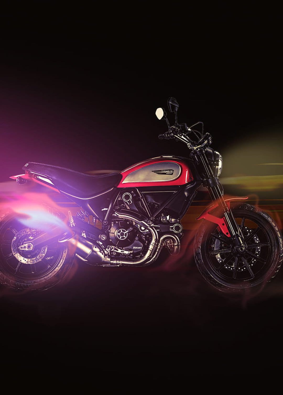 Red Ducati Scrambler motorcycle with vibrant purple flames shooting from the exhaust pipe in a dark studio.