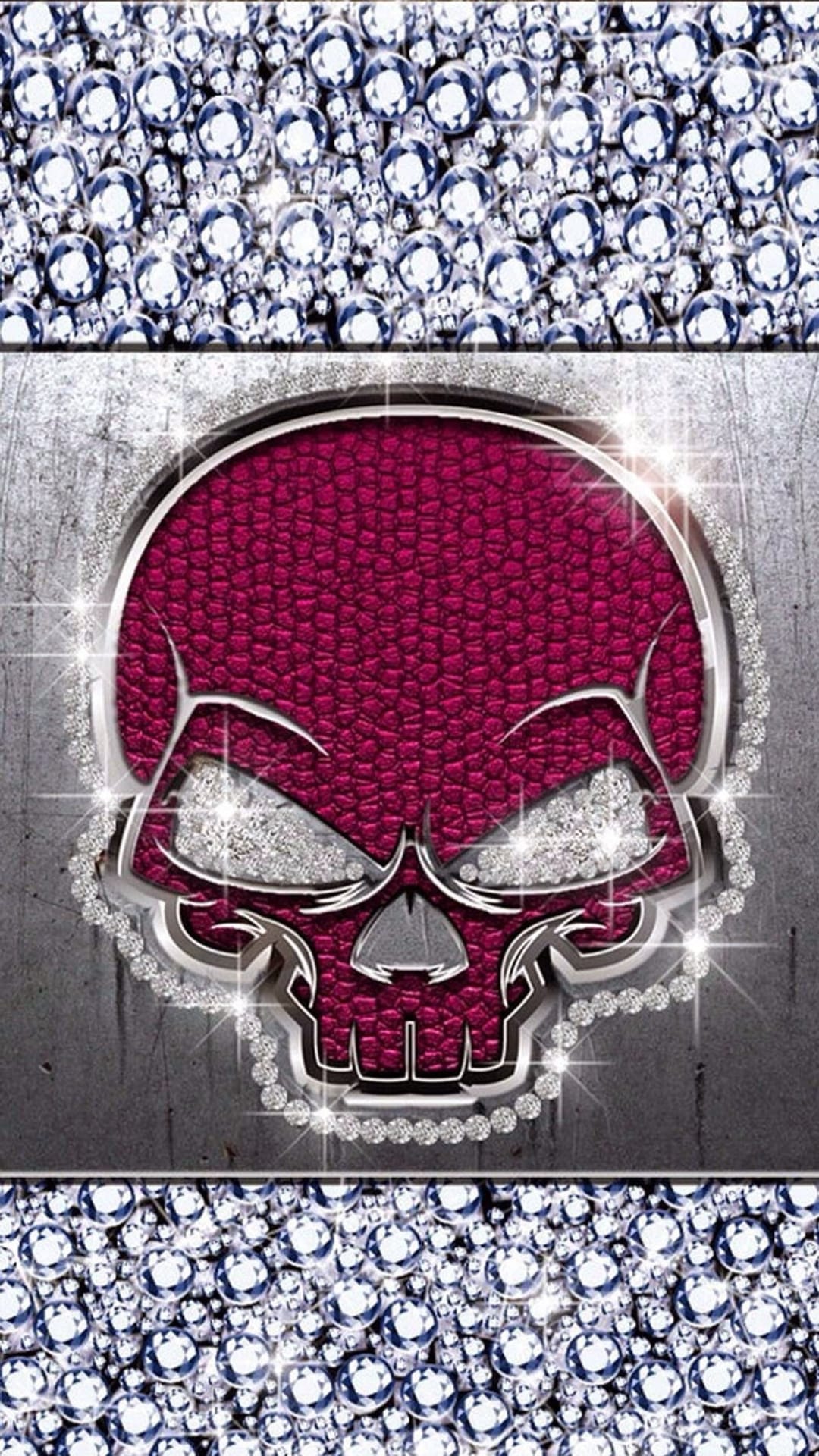 Jeweled skull with burgundy leather infill centered between crystal borders on a distressed metal background.