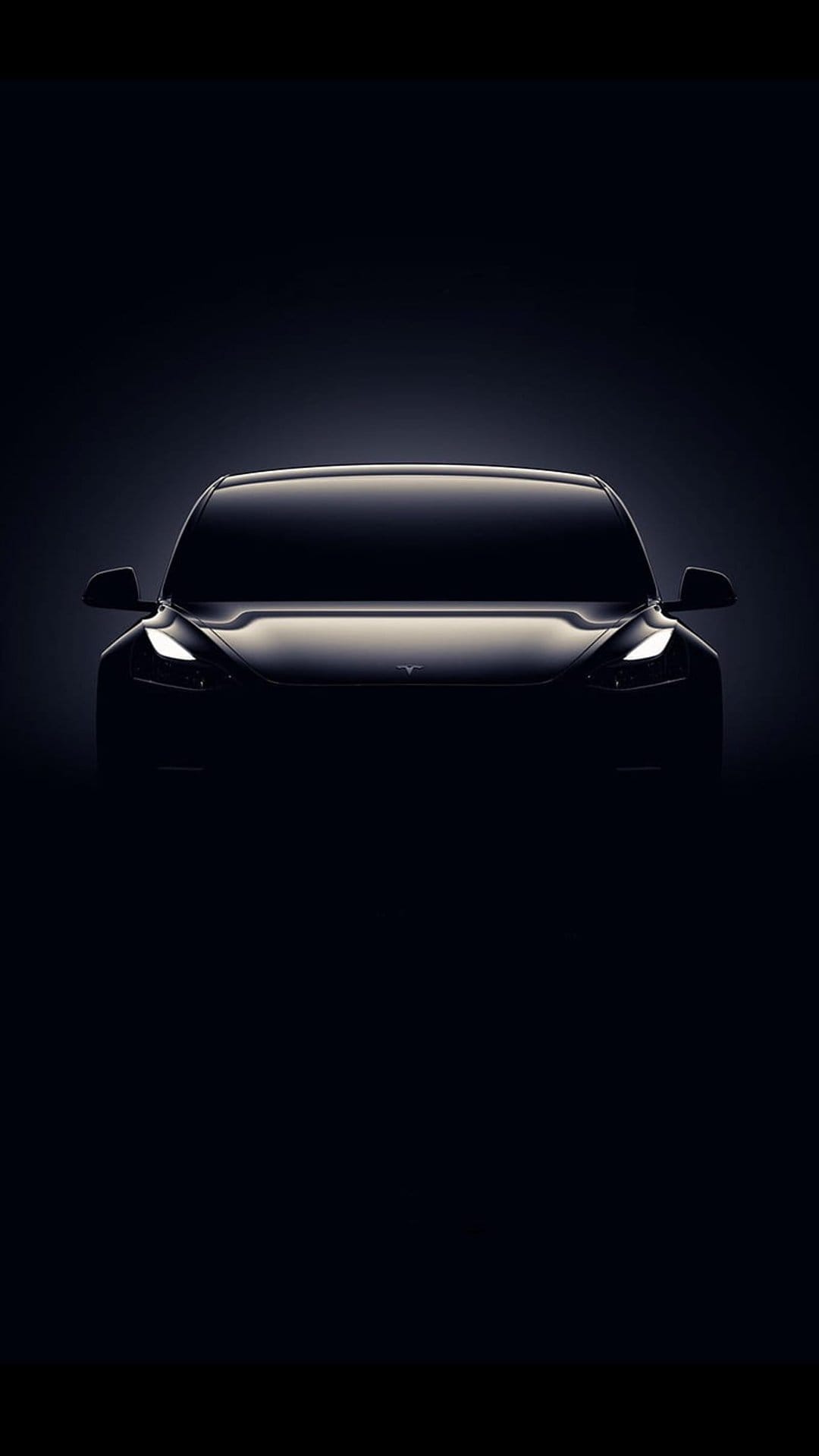 Tesla silhouette with bright LED headlights against a dark background, showcasing sleek curves and minimalist design.