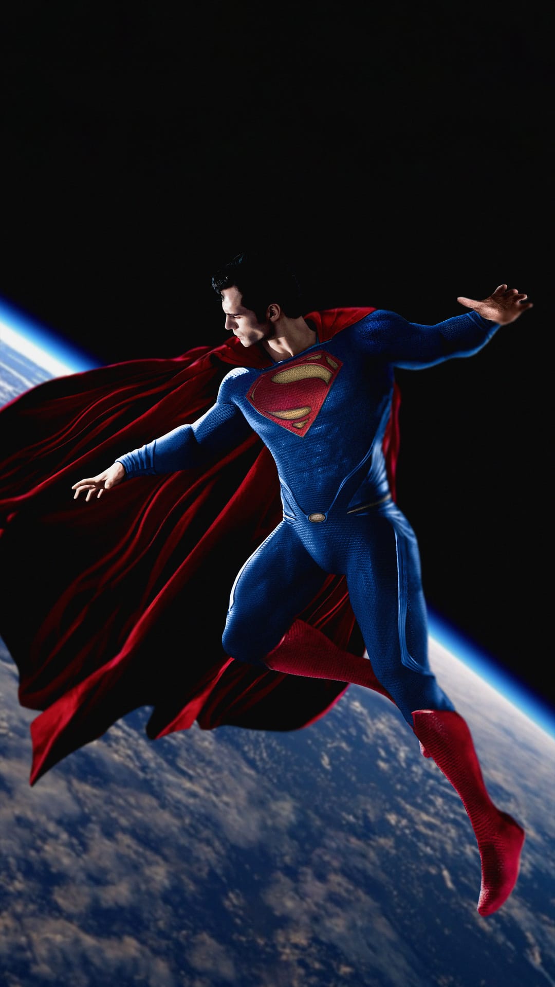 Superman flies through the dark vacuum of space with his red cape flowing as the curved Earth glows below him.
