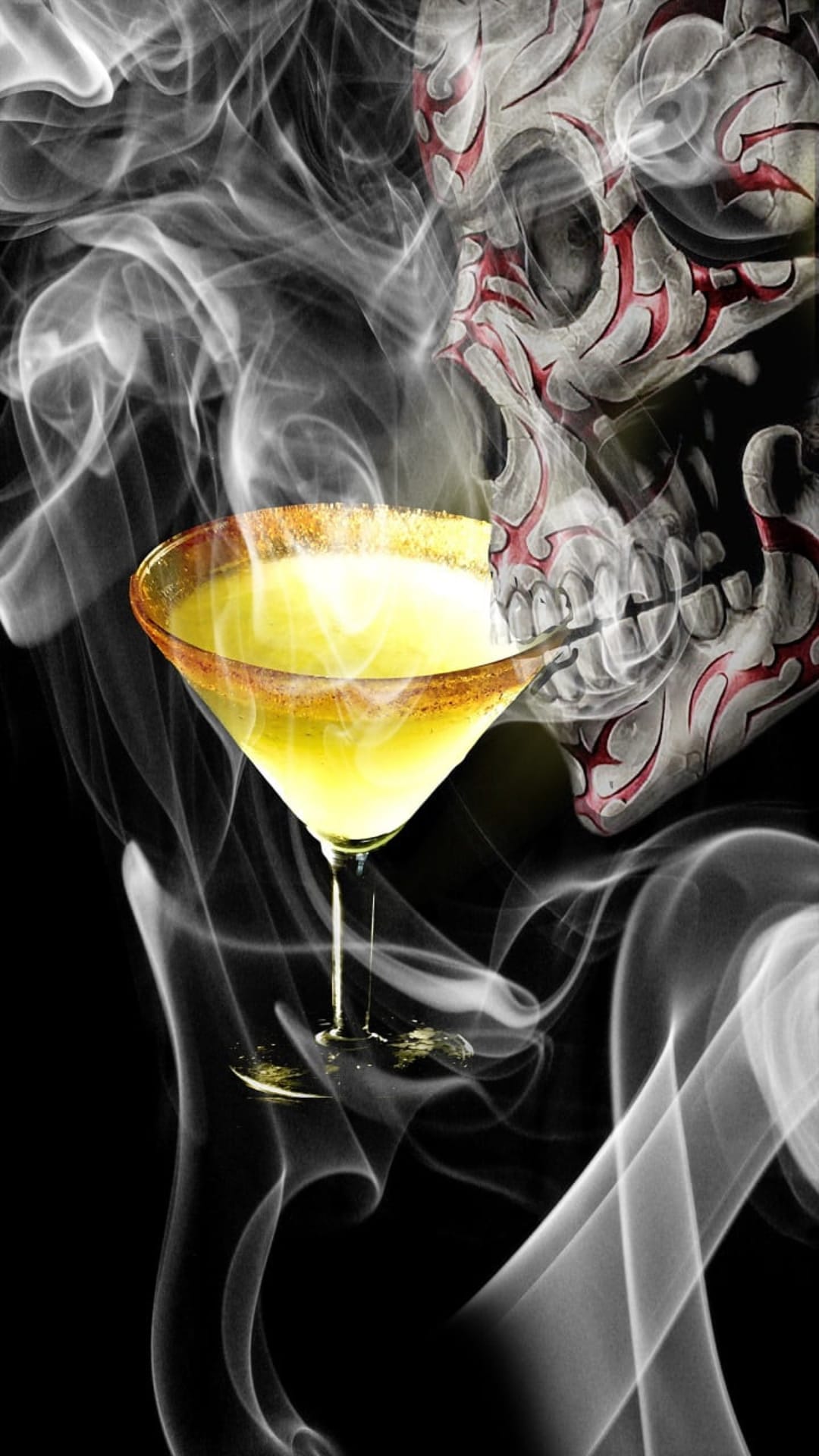 Skull-shaped smoke rises behind a yellow martini glass with a salted rim and red tribal markings on dark backdrop.