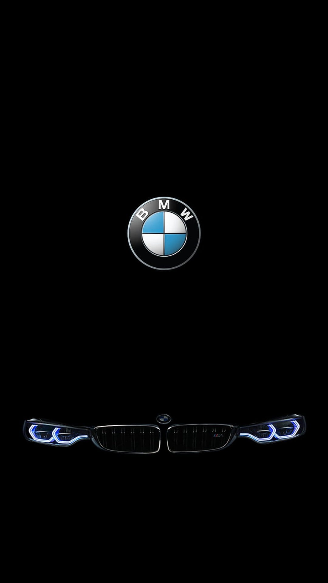 BMW emblem centered above illuminated blue daytime running lights and a car grille on a pitch-black backdrop.