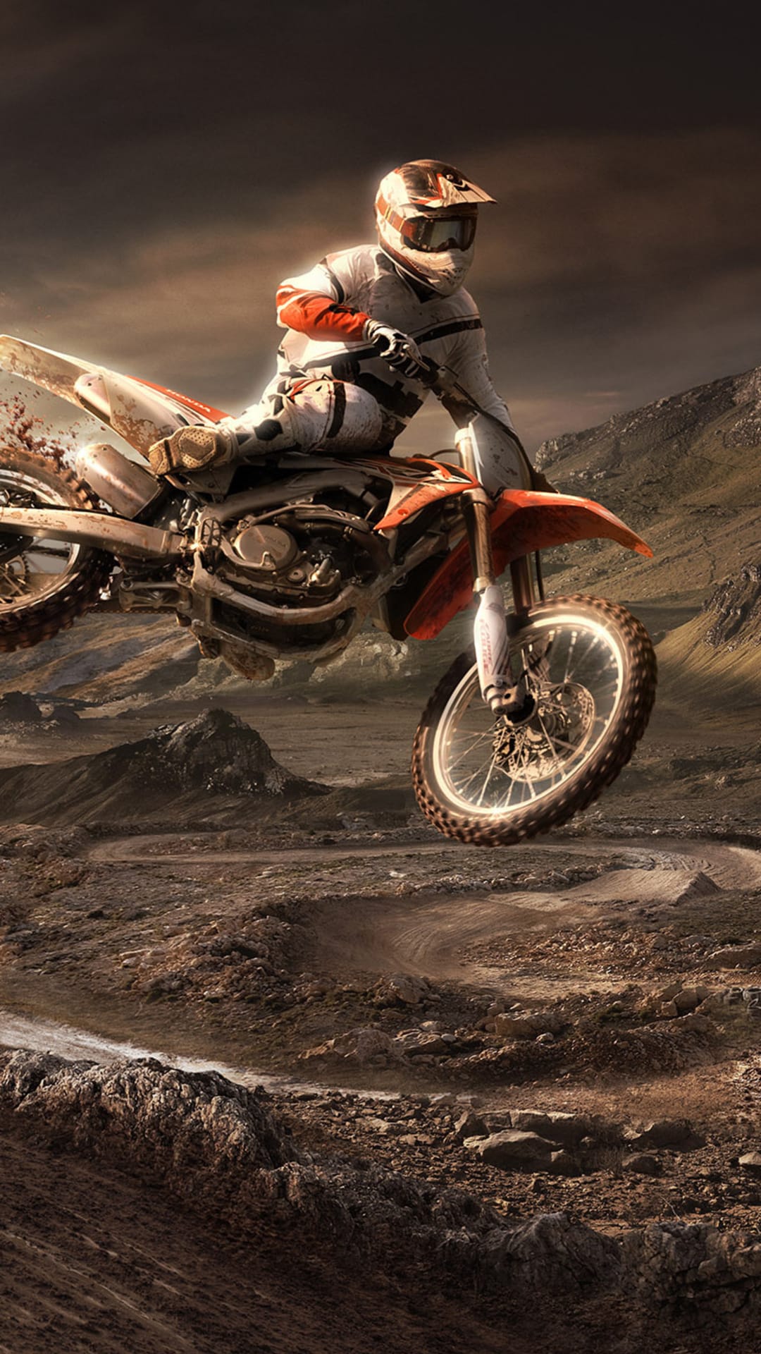 Motocross rider jumping a dirt bike over a dusty desert landscape under a dramatic and cloudy afternoon sky.