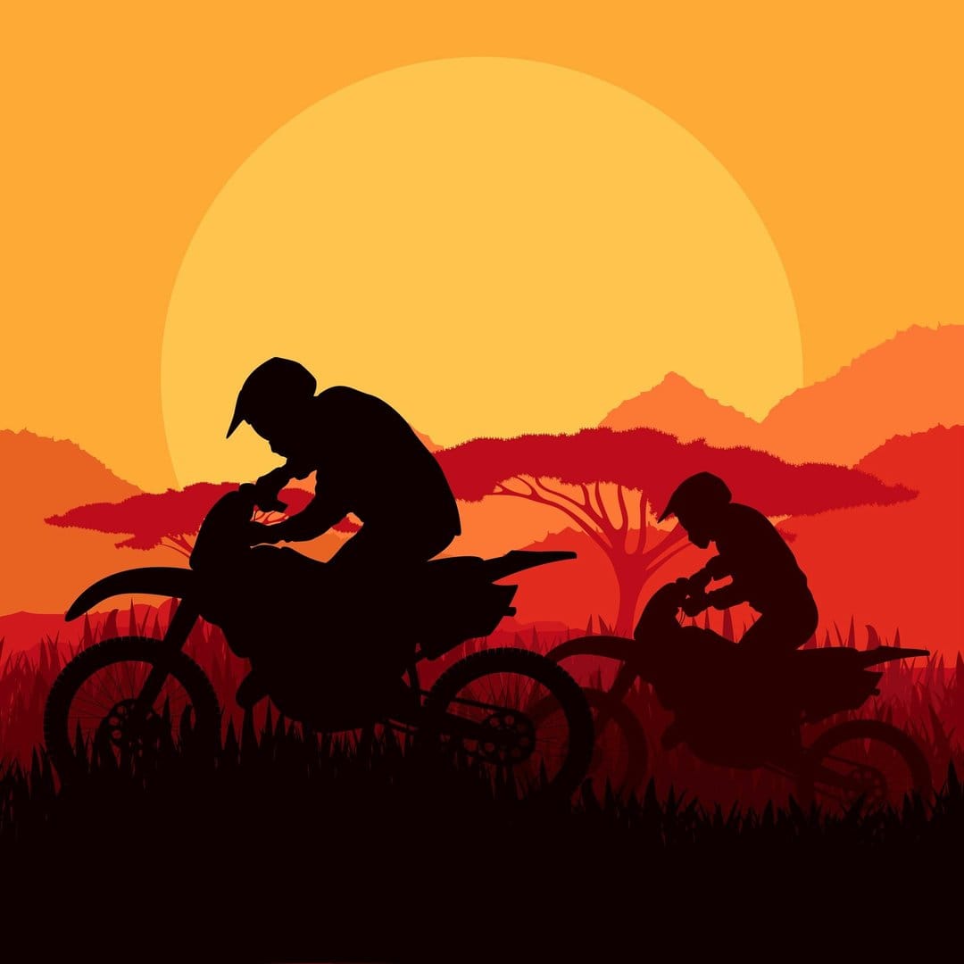 Motocross riders and acacia trees silhouetted against a massive orange sun in a vast savanna landscape.