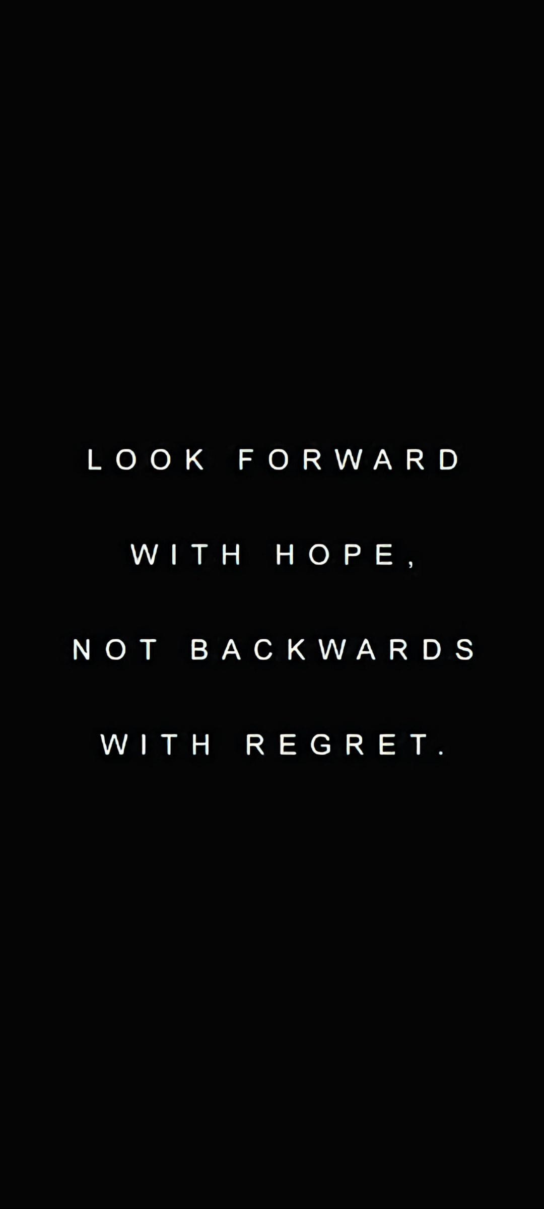 White sans-serif text reading Look forward with hope, not backwards with regret on a solid black background.
