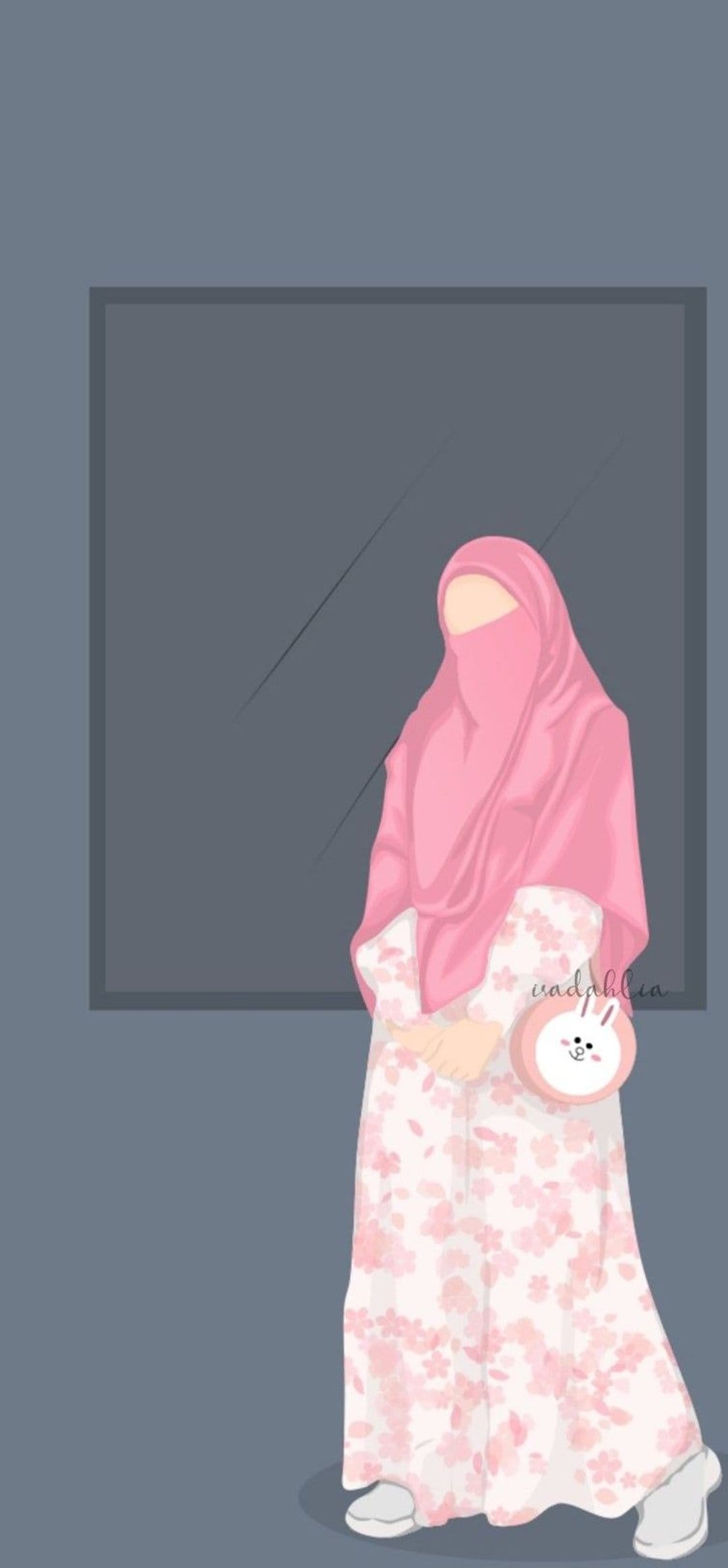 Muslim woman wearing a pink hijab and floral dress holds a bunny handbag against a minimalist dark frame.
