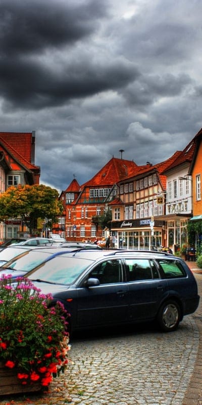 Lauenburg, Germany, street, historic, architecture, charming, old town, stormy sky, European, cobblestone, traditional, cars, picturesque, travel, clouds, buildings, town, vibrant flowers, ancient, urban, half-timbered