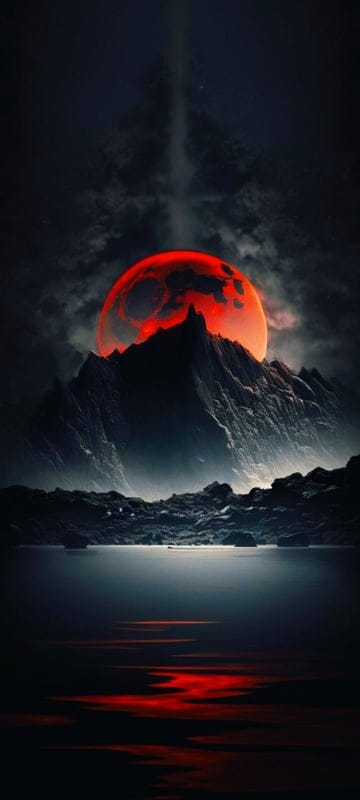 Blood-red moon looming over dark mountain ridges with a clear reflection on the surface of a still lake.