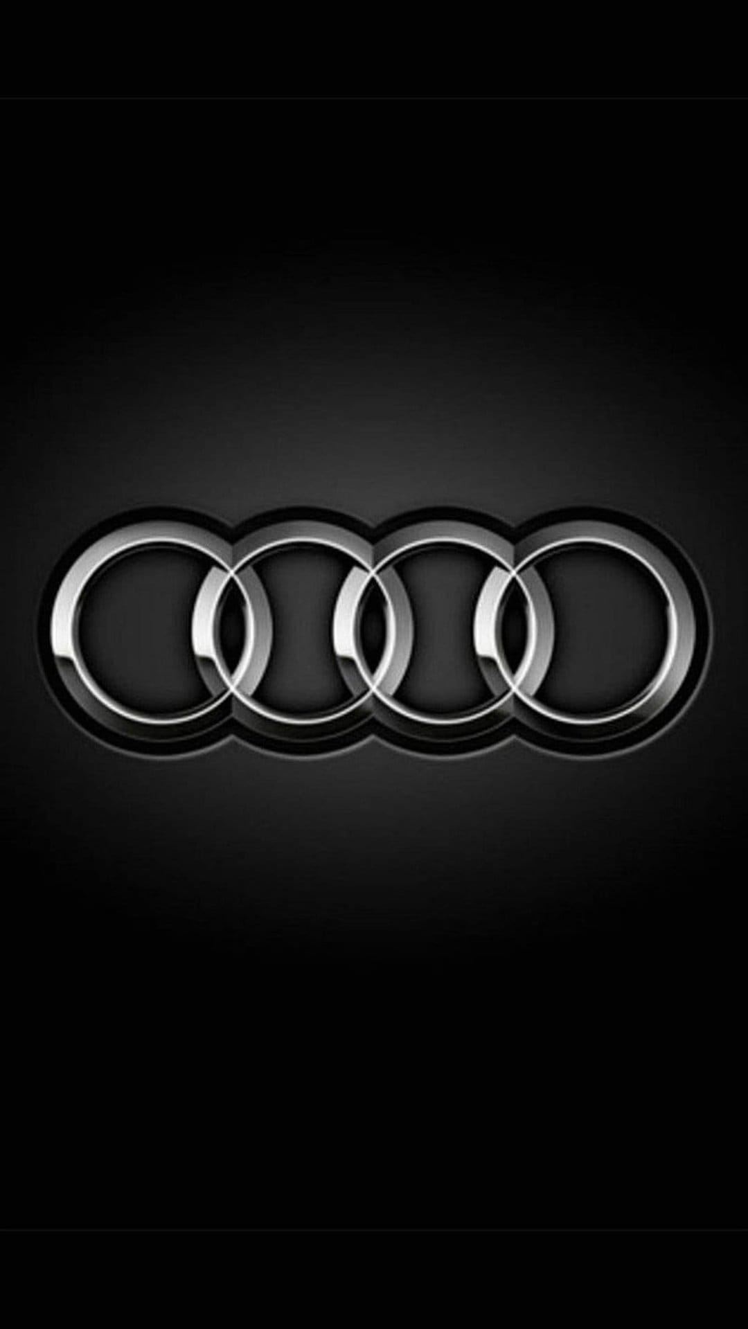 Four interlocking chrome rings with a reflective metallic finish centered on a solid black background.