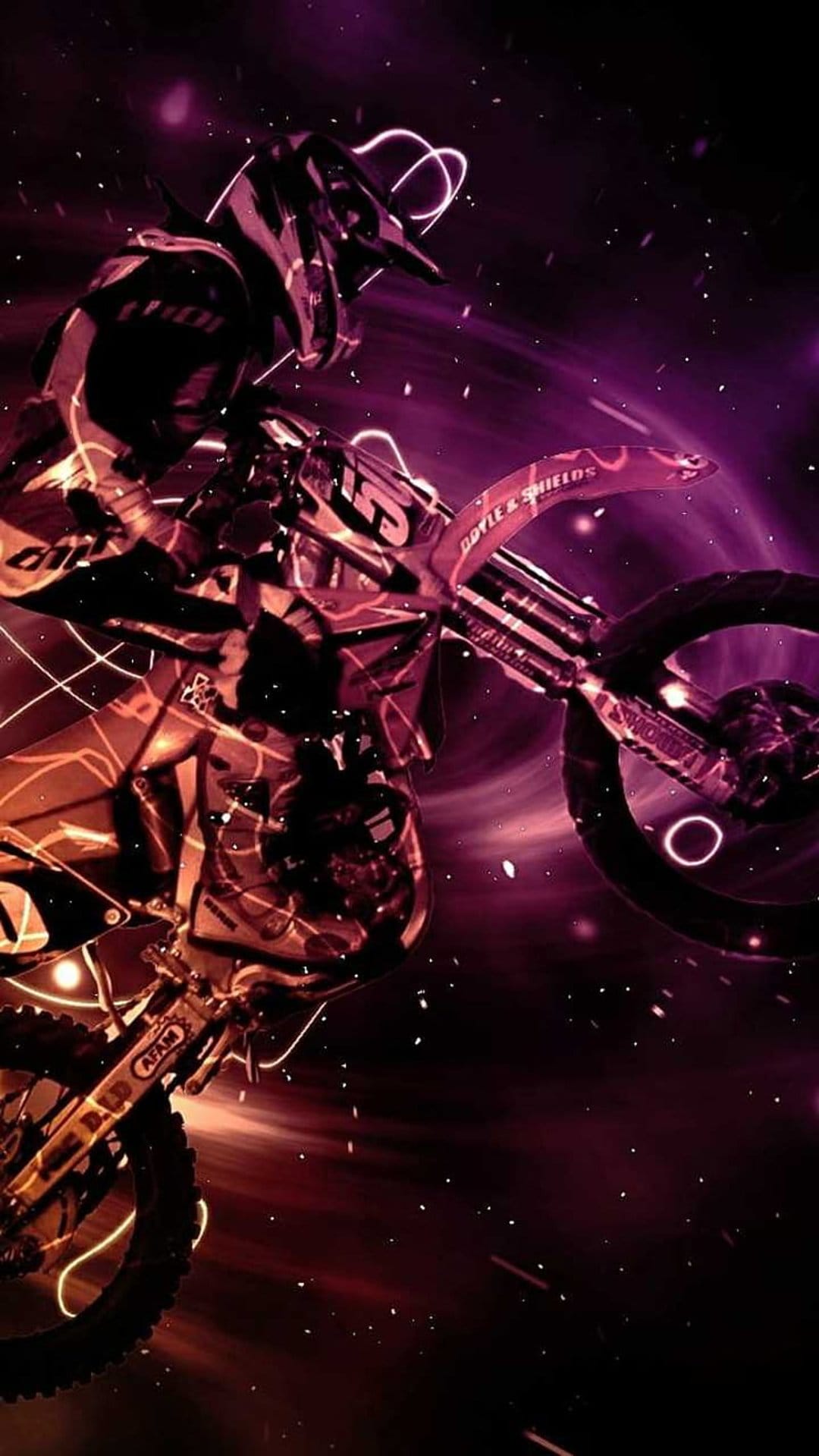 Motocross rider performs a jump amidst glowing purple and orange light trails with sparks flying in mid-air.
