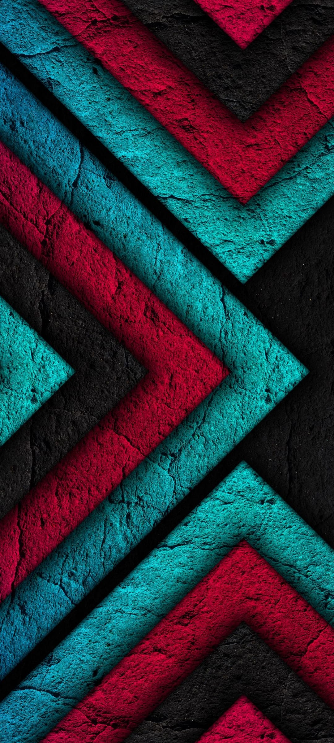Red and teal interlocking arrows display a heavy cracked texture and sharp geometric edges in a vertical layout.