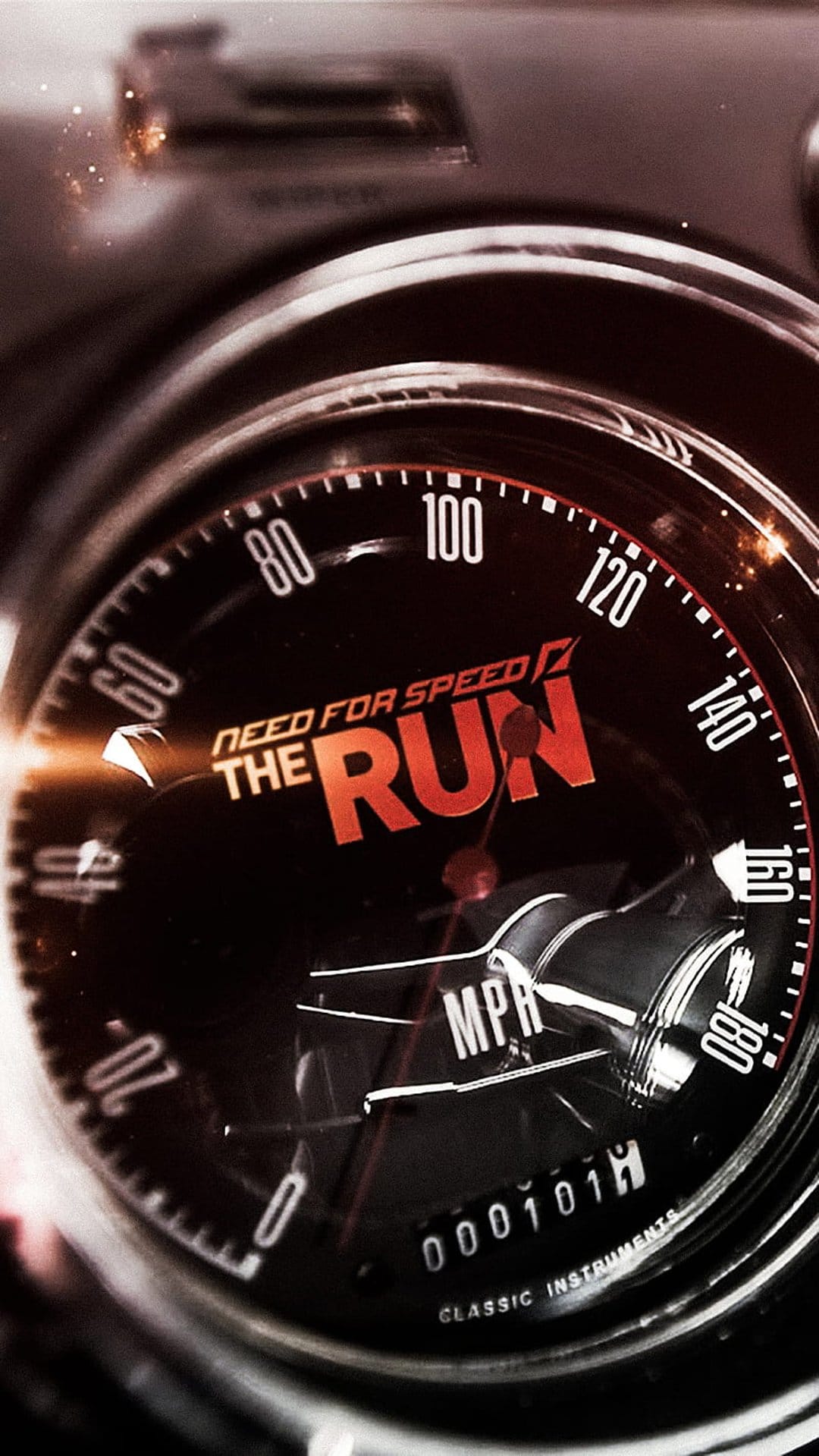 Vintage car speedometer with a glowing orange logo and a needle indicating high speed on a dark dashboard.