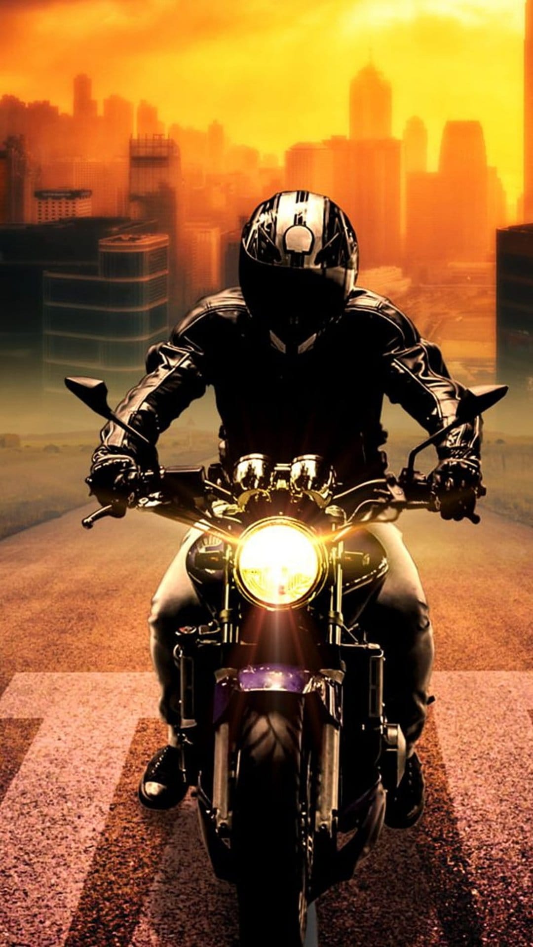 Motorcyclist silhouette riding toward a metropolitan skyline during a vibrant orange and yellow sunset.