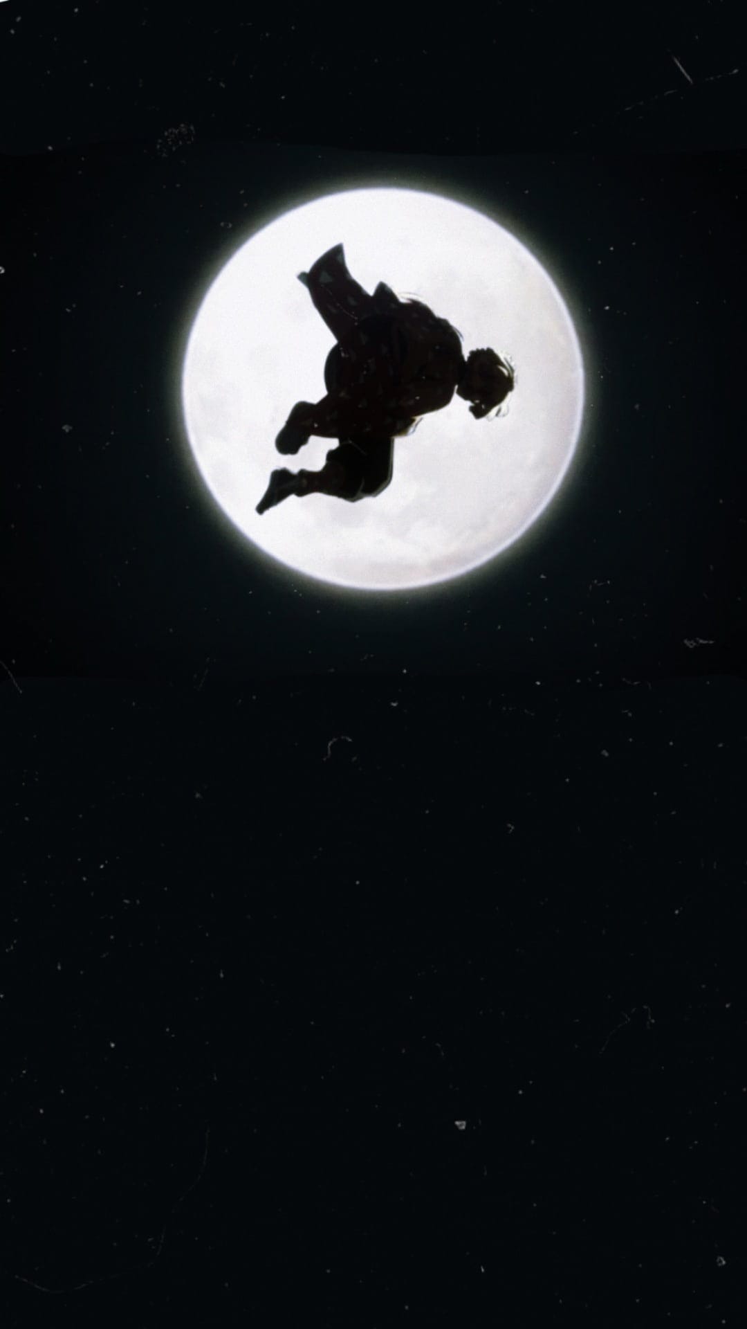 Person leaping in mid-air against a giant glowing white full moon and a starry dark night sky background.